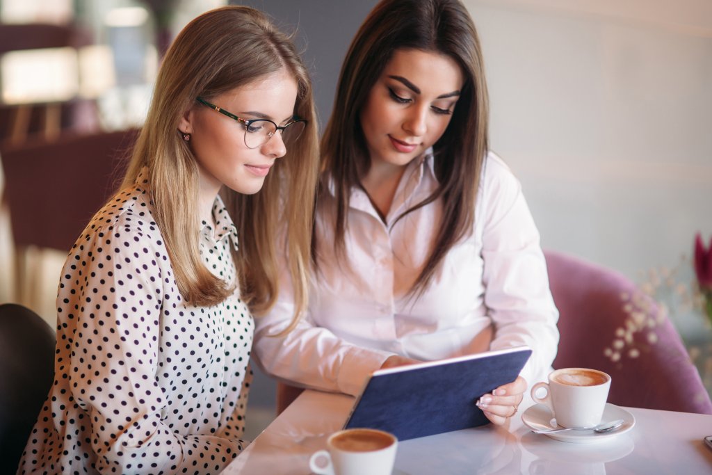 A mother and daughter going over documents together
